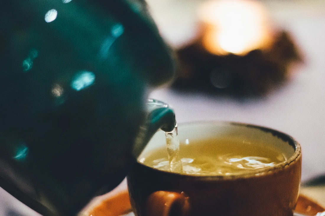 Green Tea being poured into a cup