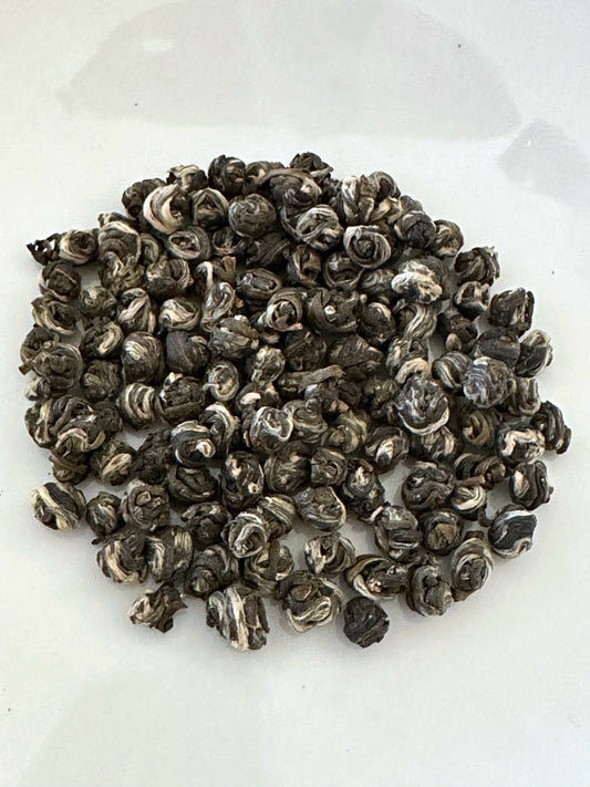 Small pile of Premium Jasmine Pearl Tea